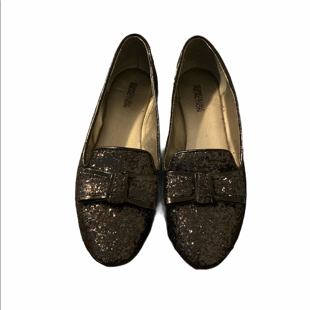 Woman’s black glitter flats